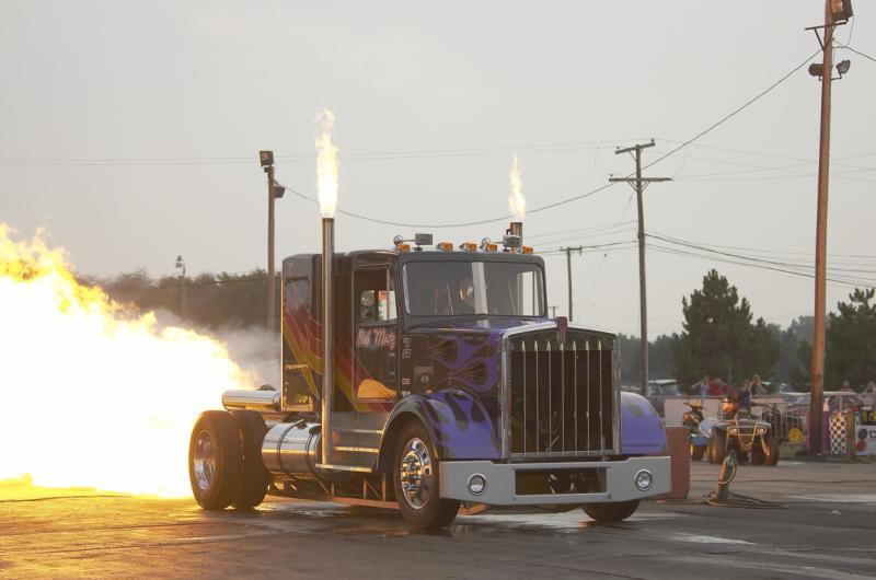 Bob Motz Jet Truck jet afterburner blast and flaming exhaust stacks cook as the truck leaves the line in smoke