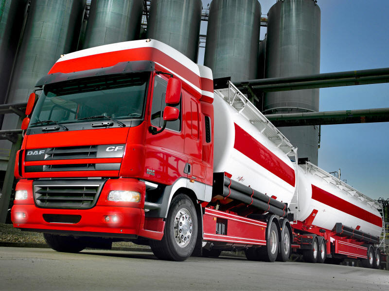 DAF CF Tanker truck with tanker trailer unloading silos at the mill 