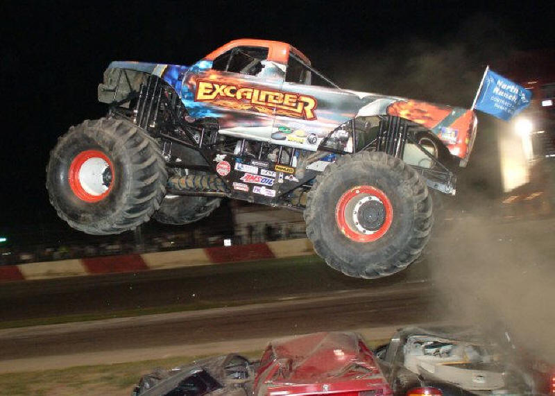 Excaliber Monster Truck flying in the air in night race