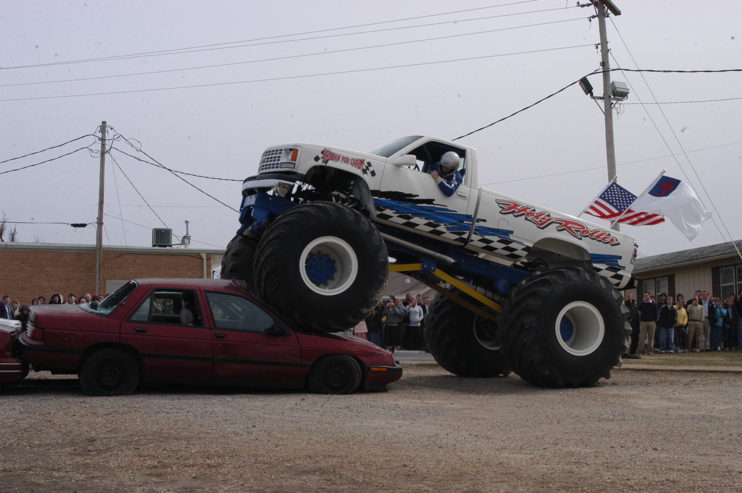 Holy Roller Monster Truck rolling over and crushing cars at this show