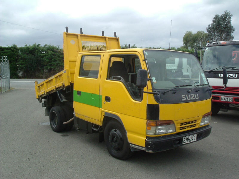 Little yellow Isuzu dumper Truck with crew cab