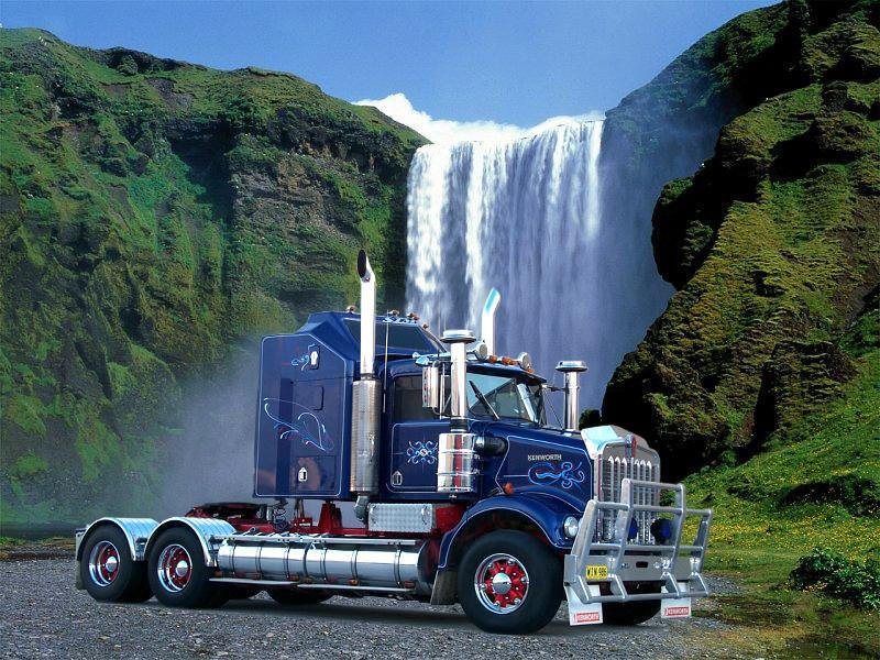 Fancy Kenworth all dressed up in front of waterfall