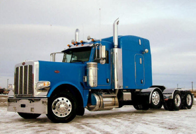 Peterbilt model 389 truck tractor picture Blue highway unit with sleeper bunk and drop down tri-axle to carry a little extra weight