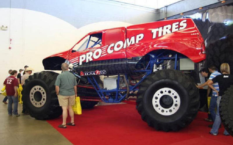 Pro Comp Tires Monster Truck showing off it's wheels at truck show
