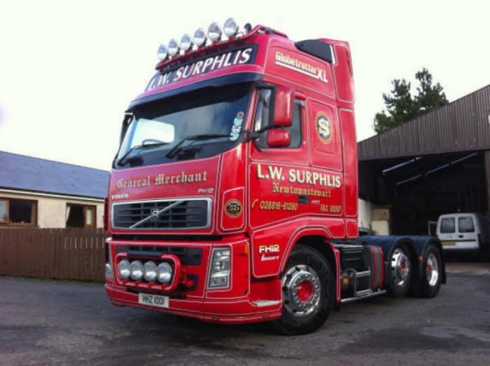 Red Volvo FH12 tractor truck