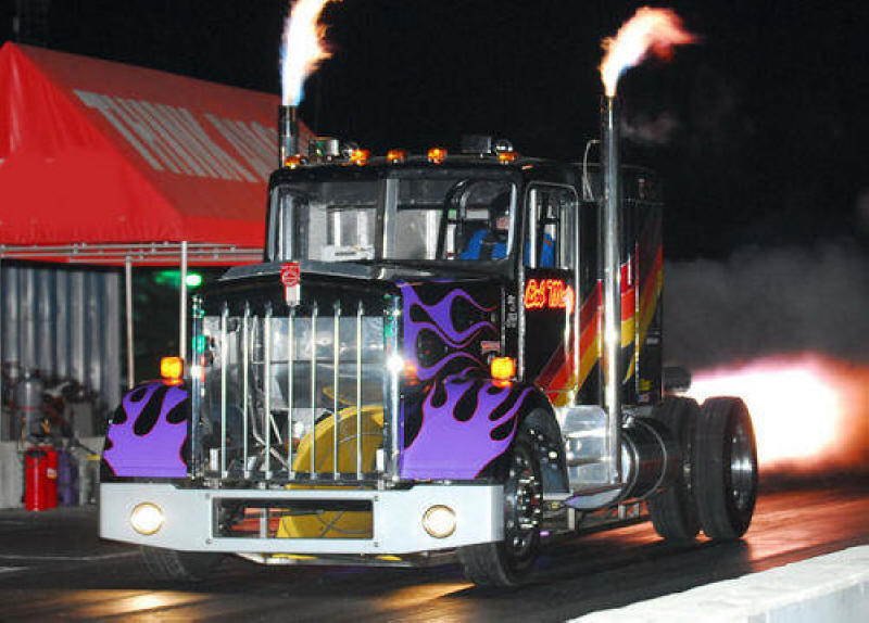 Bob Motz Jet Truck taking off from the starting line in an exciting night performance