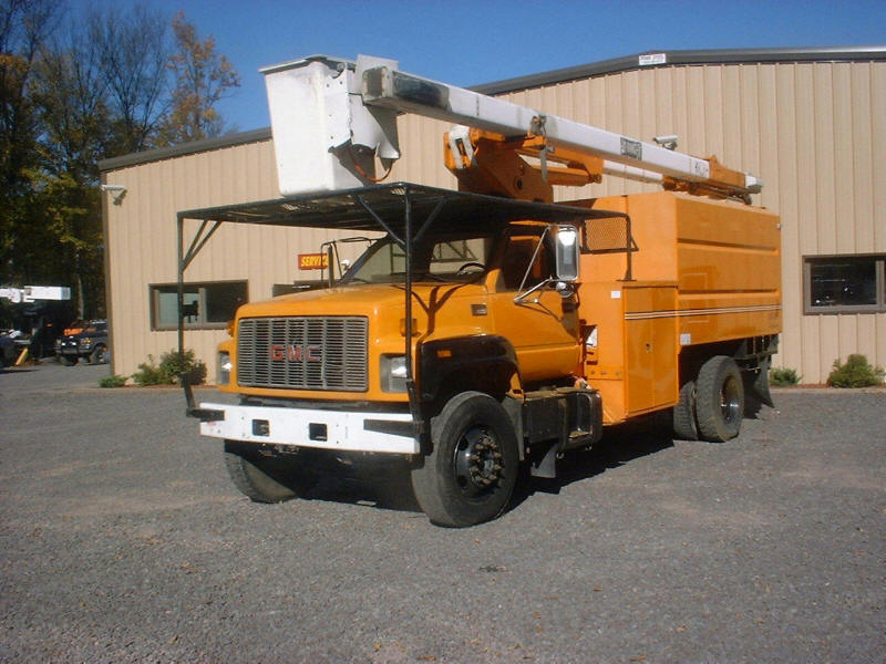 Orange GMC Utility company bucket truck with cherry picker